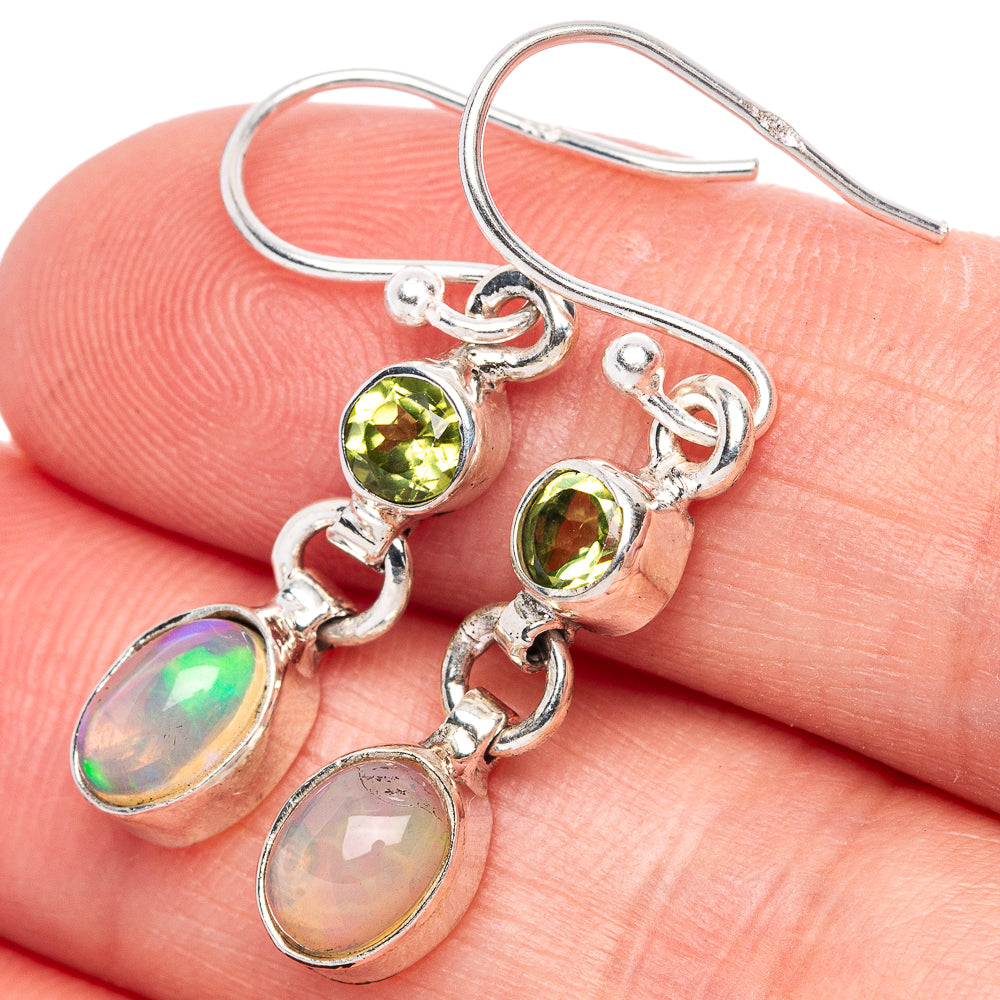 Sterling silver drop earrings with peridot green stones and oval opal charms
