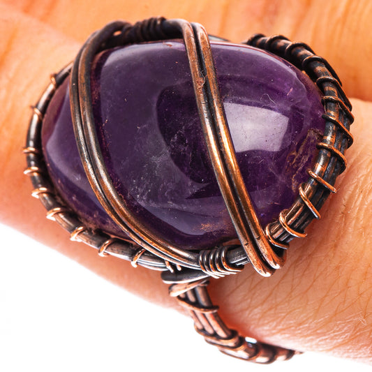 Amethyst cabochon wire ring with oxidized copper wrap, oval purple stone