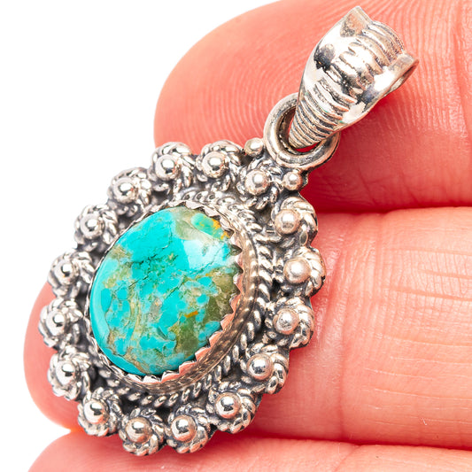 Turquoise oval pendant in ornate .925 sterling silver with beaded border and bail top