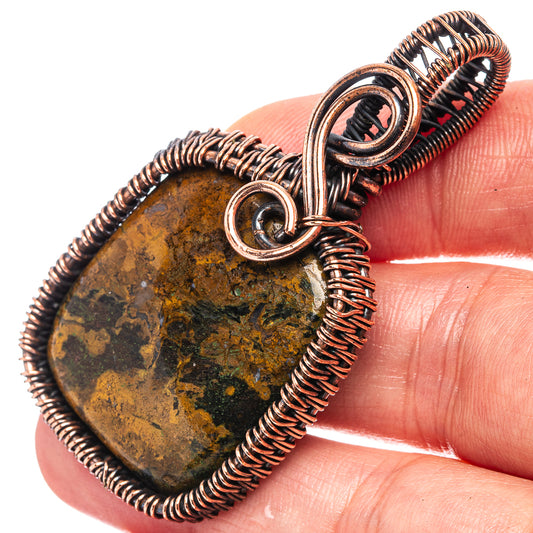 Oxidized copper wire-wrapped pendant with dark agate stone and round bail loop