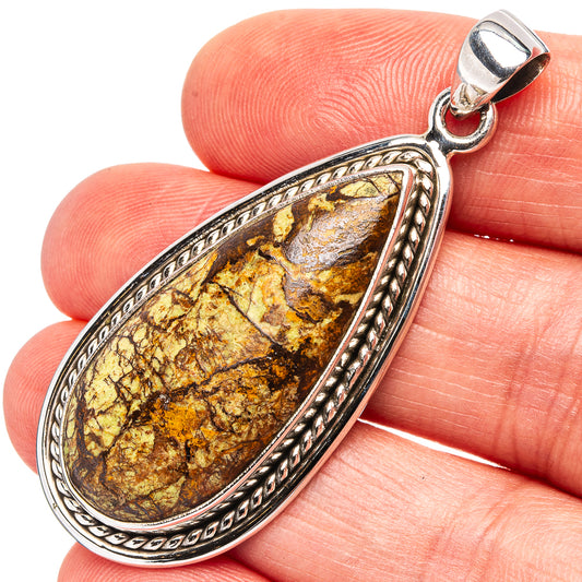 Oval .925 sterling silver pendant with dark bronze-gold gaspeite stone and ornate rope border