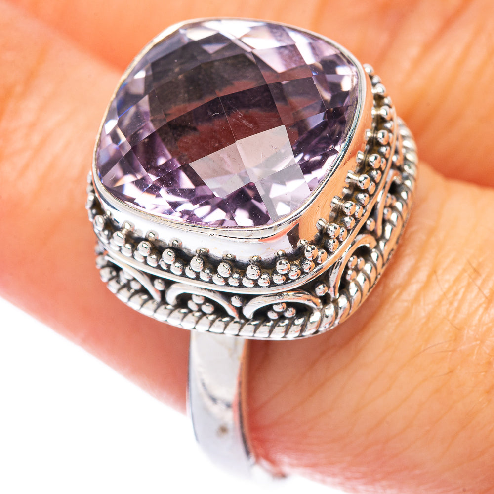 Faceted purple amethyst oval ring with detailed bead and filigree silver band