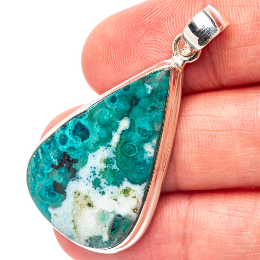 Teardrop opal pendant in .925 sterling silver with teal and white stone