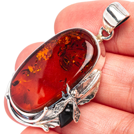 Oval amber bee pendant with dark amber stone, .925 silver frame and bee charm