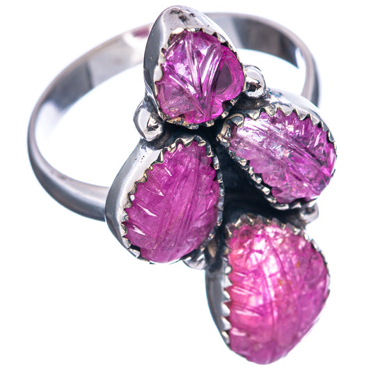 Sterling silver gemstone ring featuring four oval pink-purple stones with black prongs