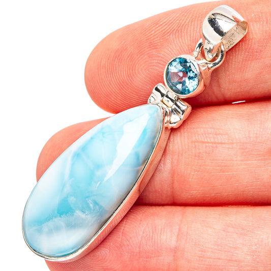 Sterling silver pendant with blue larimar teardrop stone and blue topaz round accents