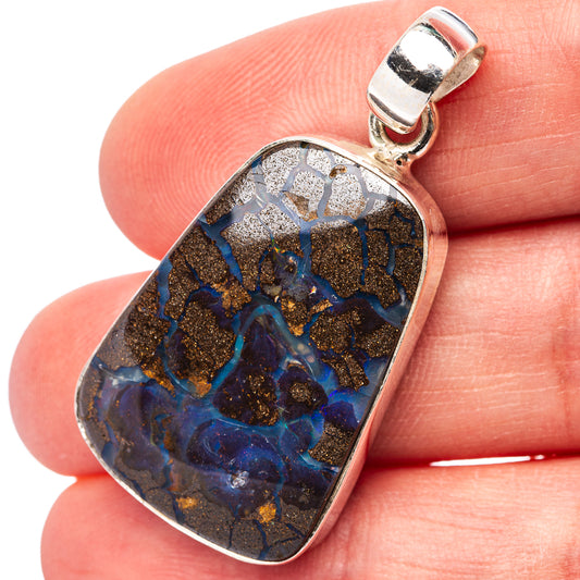 Sterling silver opal pendant with blue and gold mottled stone, rectangular bezel.