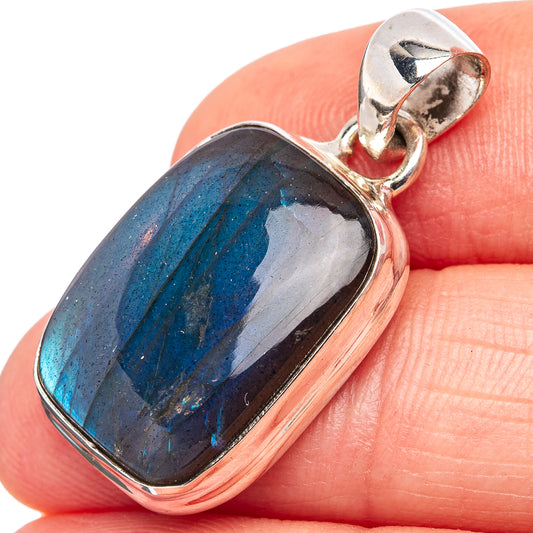 Labradorite pendant in .925 sterling silver bezel, dark stone with vivid blue iridescence.