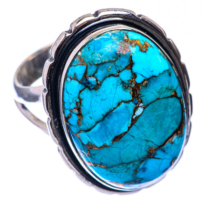 Turquoise oval cabochon silver ring with black bezel and copper vein details