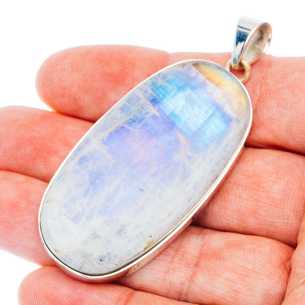 Rainbow moonstone oval pendant in 925 sterling silver bezel, blue-white iridescent