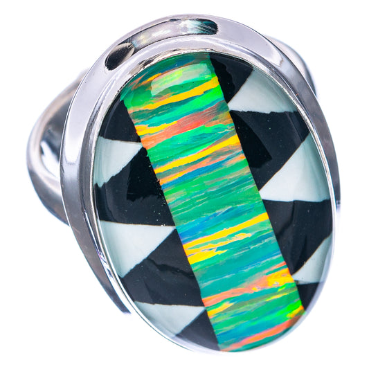 Silver-toned oval ring with black-and-white checker accents around green opal inlay