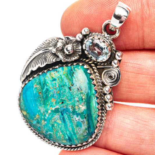 Sterling silver opal pendant with oval blue-green cabochon, ornate leaf and bead setting