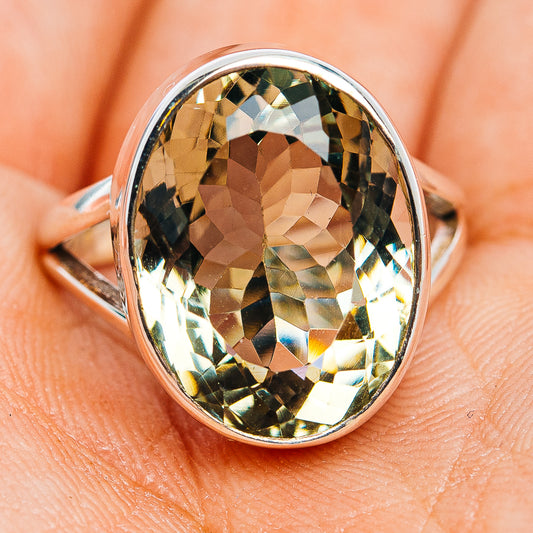 Green amethyst faceted oval ring with polished sterling silver band, side angle
