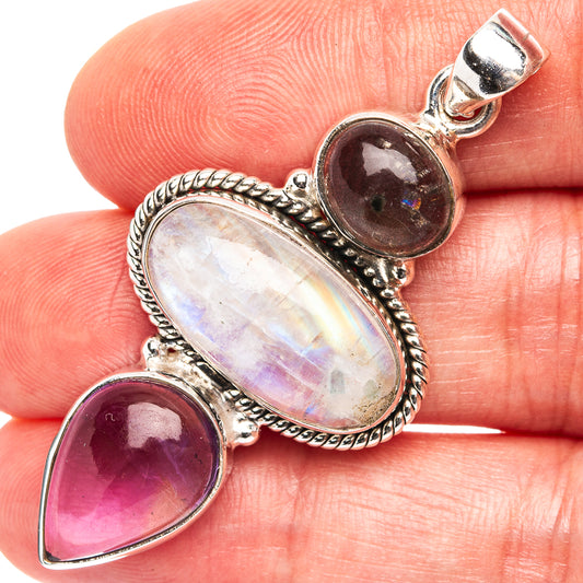 Sterling silver pendant with rainbow moonstone oval and amethyst teardrop accents