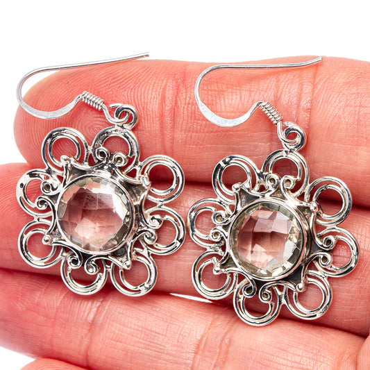 Sterling silver dangle earrings with round faceted light gemstone in ornate filigree