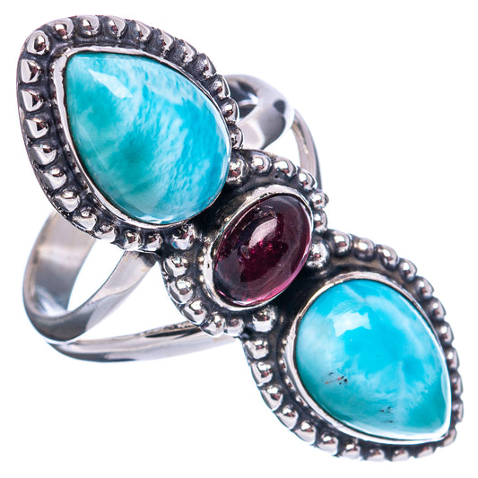 Turquoise larimar teardrop ring with oval dark garnet center, scalloped silver border