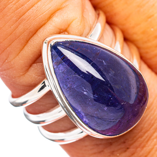 Sterling silver tanzanite ring with oval purple-blue gemstone, split shank bezel setting