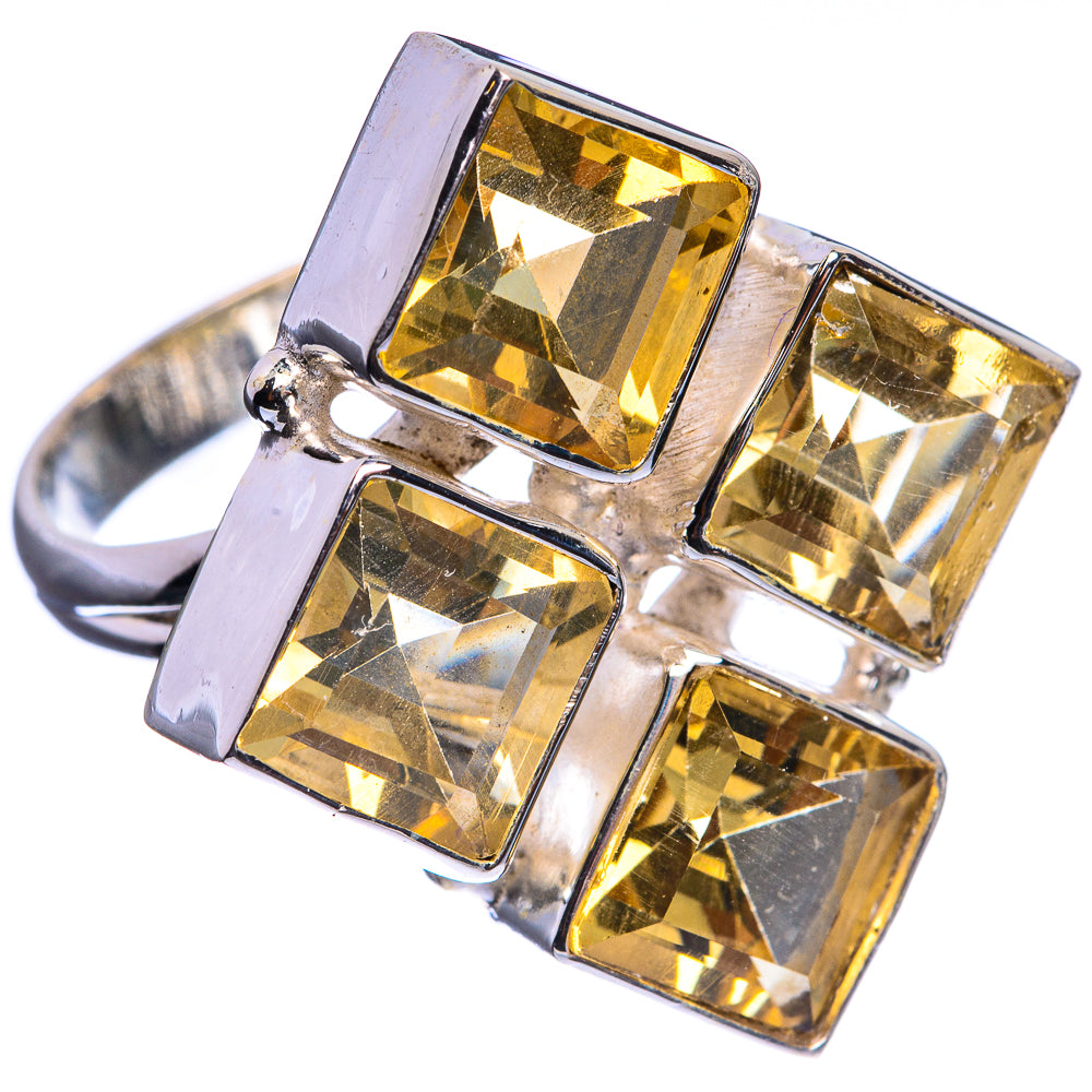 Sterling silver ring with square faceted citrine stones in a cross setting.