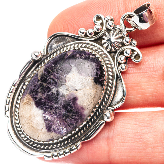 Sterling silver lepidolite pendant with oval purple gemstone cabochon and ornate bezel