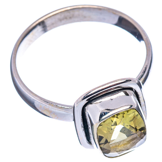 Sterling silver ring with faceted lemon quartz bezel set, visible from side.