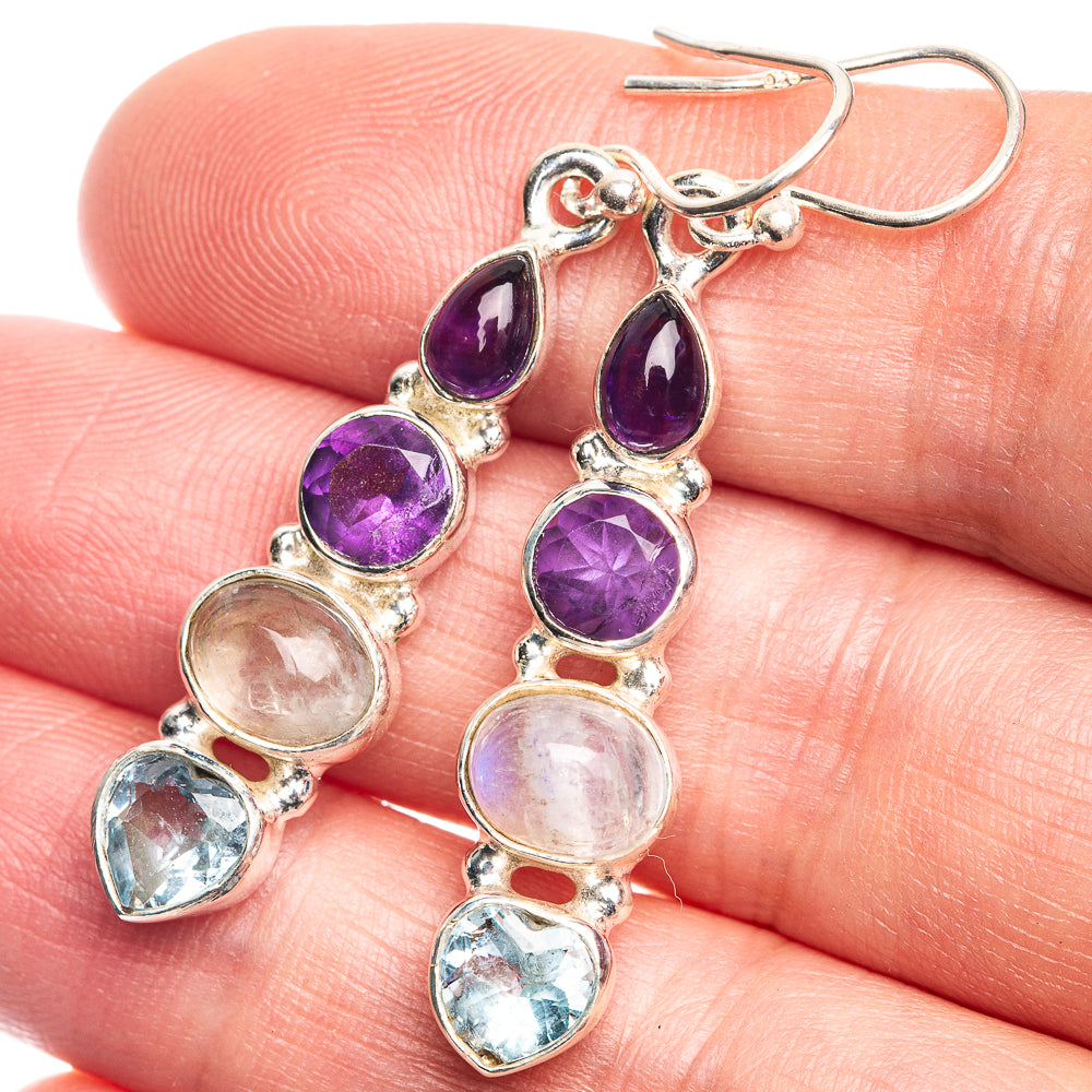 Sterling silver drop earrings with oval amethyst, moonstone, and blue topaz accents