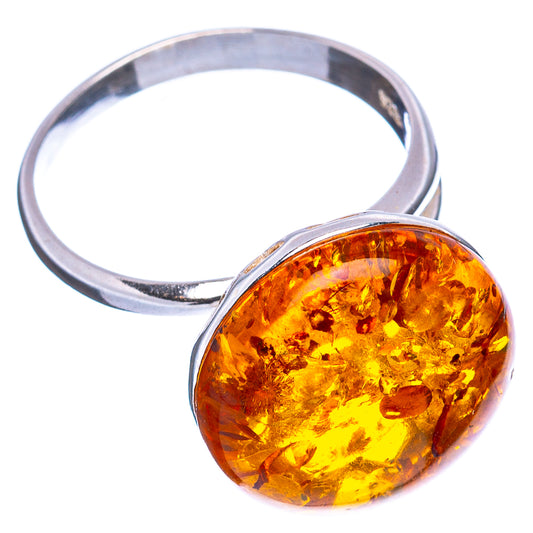 Baltic amber oval cabochon ring with polished .925 sterling silver band, angled view