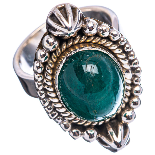Green oval emerald cabochon ring with beaded bezel and silver adjustable band