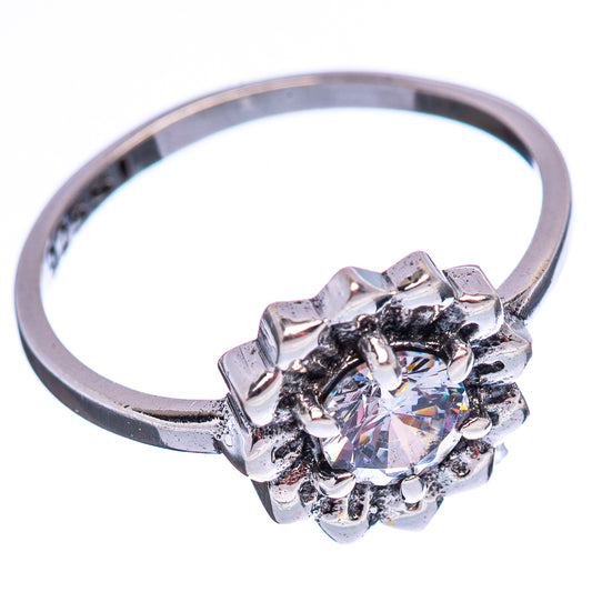Sterling silver cubic zirconia ring with round center stone and clustered halos