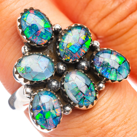 Sterling silver opal ring with six oval rainbow stones and ornate prongs, adjustable band