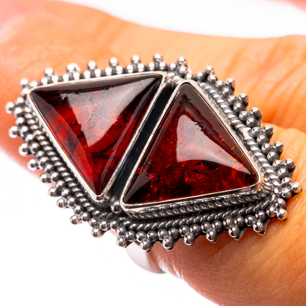 Triangular amber ring with dark red stones and silver bead halo, bold statement style