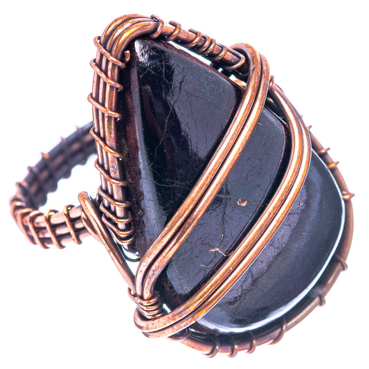 Jet ring with dark triangular jet stone, oxidized copper wrap and split shank detail