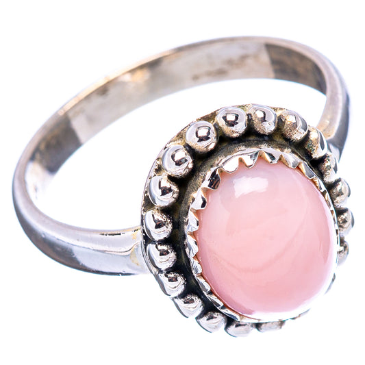 Sterling silver ring with oval pink opal cabochon and bead halo detail