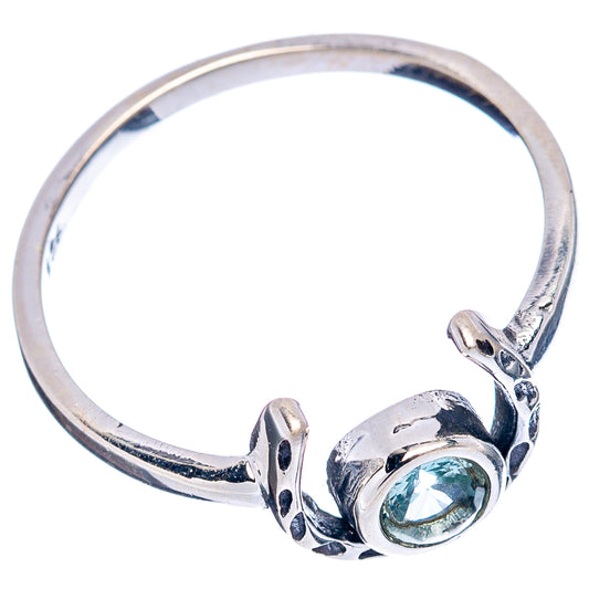 Sterling silver horseshoe ring with blue topaz oval stone and raised side details