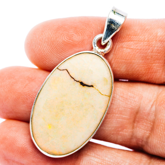 Oval opal pendant in .925 sterling silver bezel, with silver bail and natural vein pattern