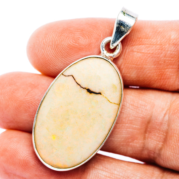 Oval opal pendant in .925 sterling silver bezel, with silver bail and natural vein pattern