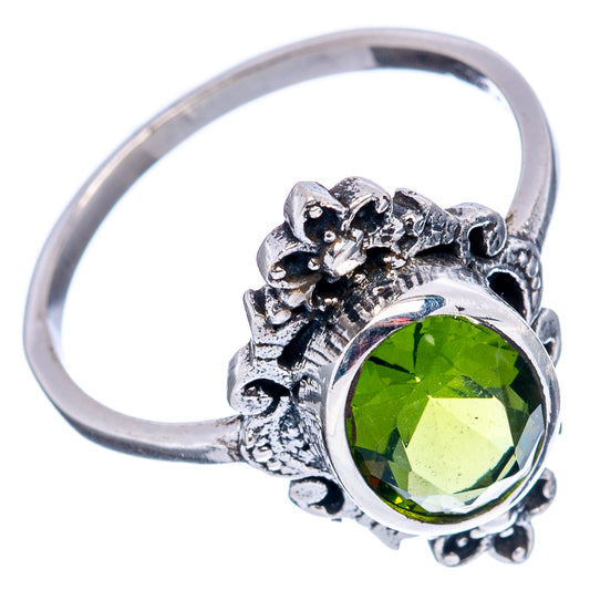 Sterling silver dainty ring with round green gemstone and ornate filigree halo