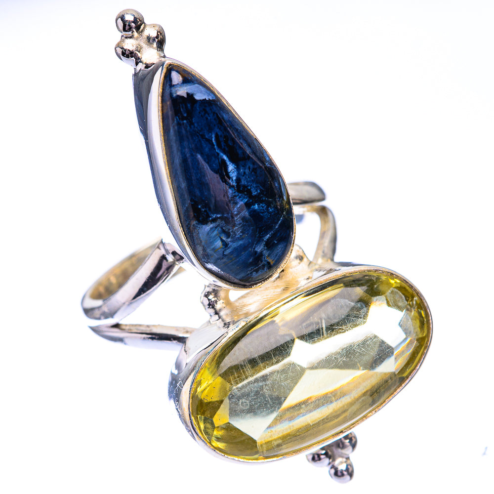 Two-stone sterling silver ring with dark blue and yellow teardrop gemstones, pronged
