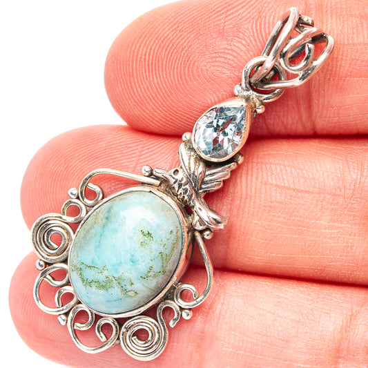Hummingbird pendant with oval blue-green stone and .925 sterling silver filigree, close-up