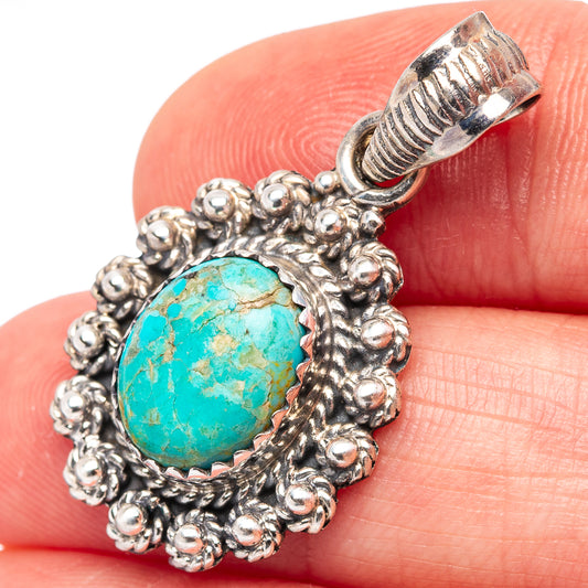 Turquoise oval .925 sterling silver pendant with textured bail and beadwork frame