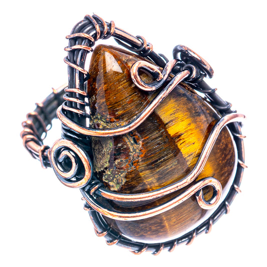 Oxidized copper wire-wrap ring with tiger-eye amber oval cabochon and openwork wire