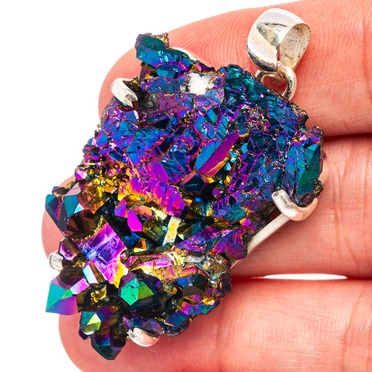 Close-up aura quartz pendant charm with iridescent crystals in silver prong setting