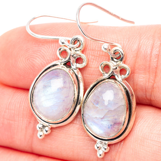 Sterling silver moonstone teardrop earrings with red bead details and hook backs