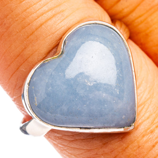 Heart-shaped sterling silver ring with light blue stone, size 9.5