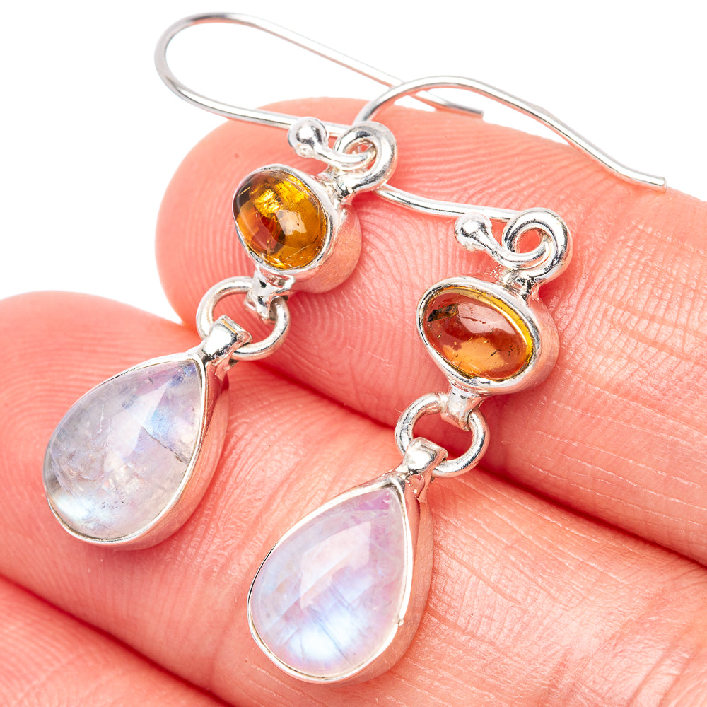 Sterling silver drop earrings with amber top stones and pear-shaped opal moonstone drops