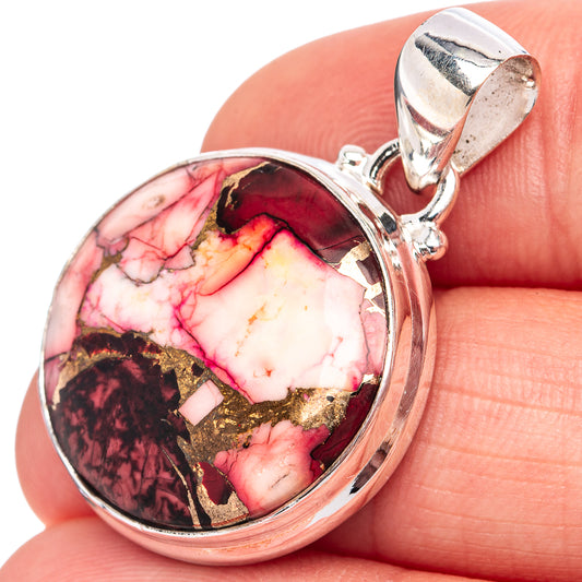 Sterling silver round pendant close-up with red-and-white marbled stone and gold flecks.