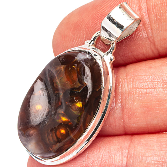 Oval Mexican fire agate pendant in .925 sterling silver bezel, warm amber and dark brown