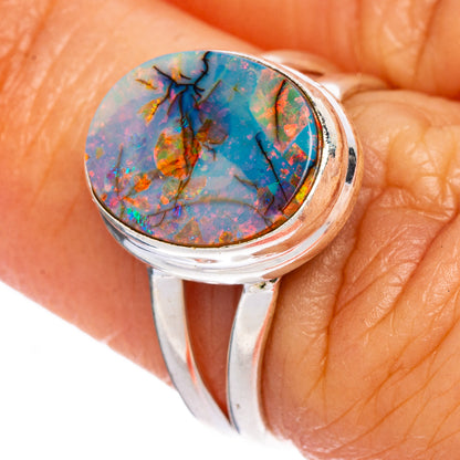 Sterling silver opal cabochon ring with oval colorful stone set in bezel