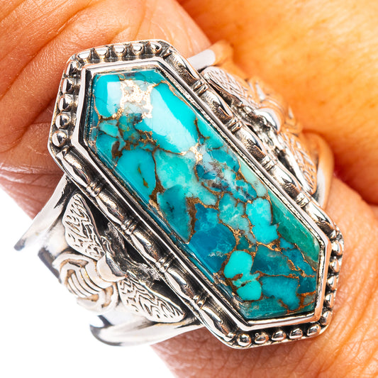 Sterling silver turquoise ring with rectangular blue-green stone and ornate side details