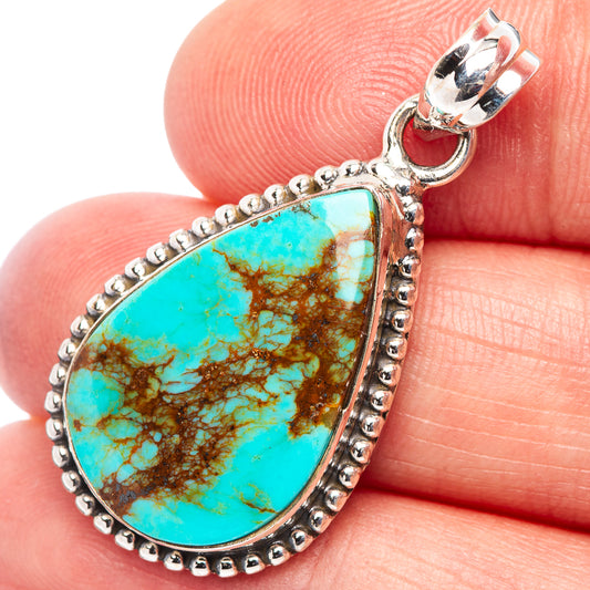 Turquoise teardrop pendant with beaded border and silver setting, open bail