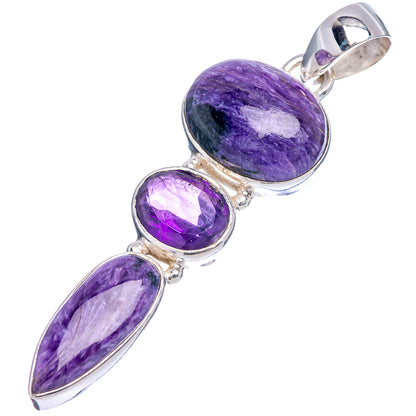 Purple gemstone pendant with arched bail, three oval and round stones in .925 sterling silver